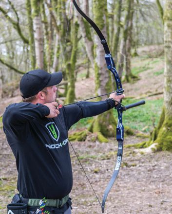 man shooting arrow