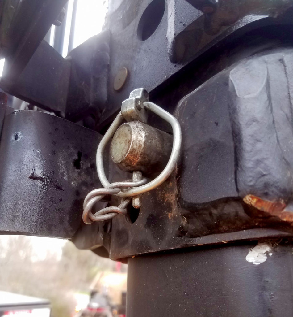 A safety lynch pin with stiff wire added in such a way that the spring clip cannot be opened by a stray branch.