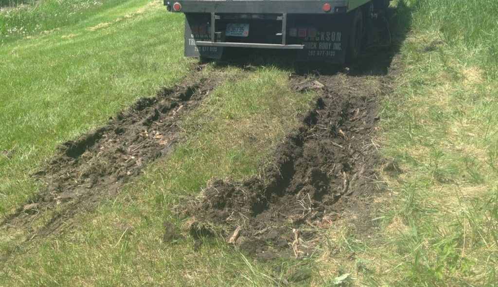 Saturated soils are highly susceptible to soil compaction. Special care must be taken during wet parts of the year such as spring, when this truck got stuck. Operations may need to be delayed or altered based on current soil conditions.