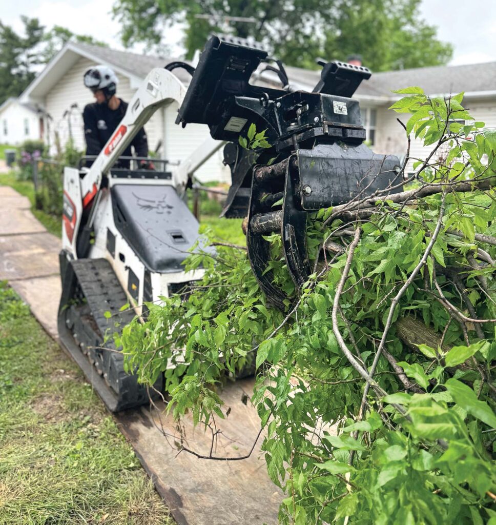 Andy Jones likes a rotating grapple that locks into position. “The big thing is that it’s not free spinning, therefore you have more control,” Jones says. Photo courtesy of Rooted Arbor Care.