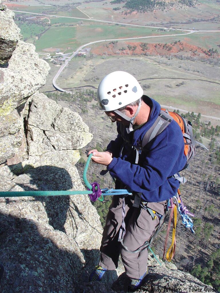 John Ball climbing at Devils Tower National Monument in Wyoming. ""It has been interesting to see the difference in gear and techniques between rock climbing and tree climbing," says Ball.