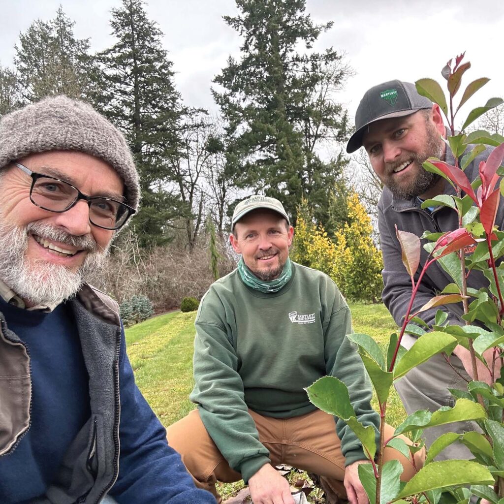 Tom Smiley, left, in the field with a pair of Bartlett Tree Experts co-workers.