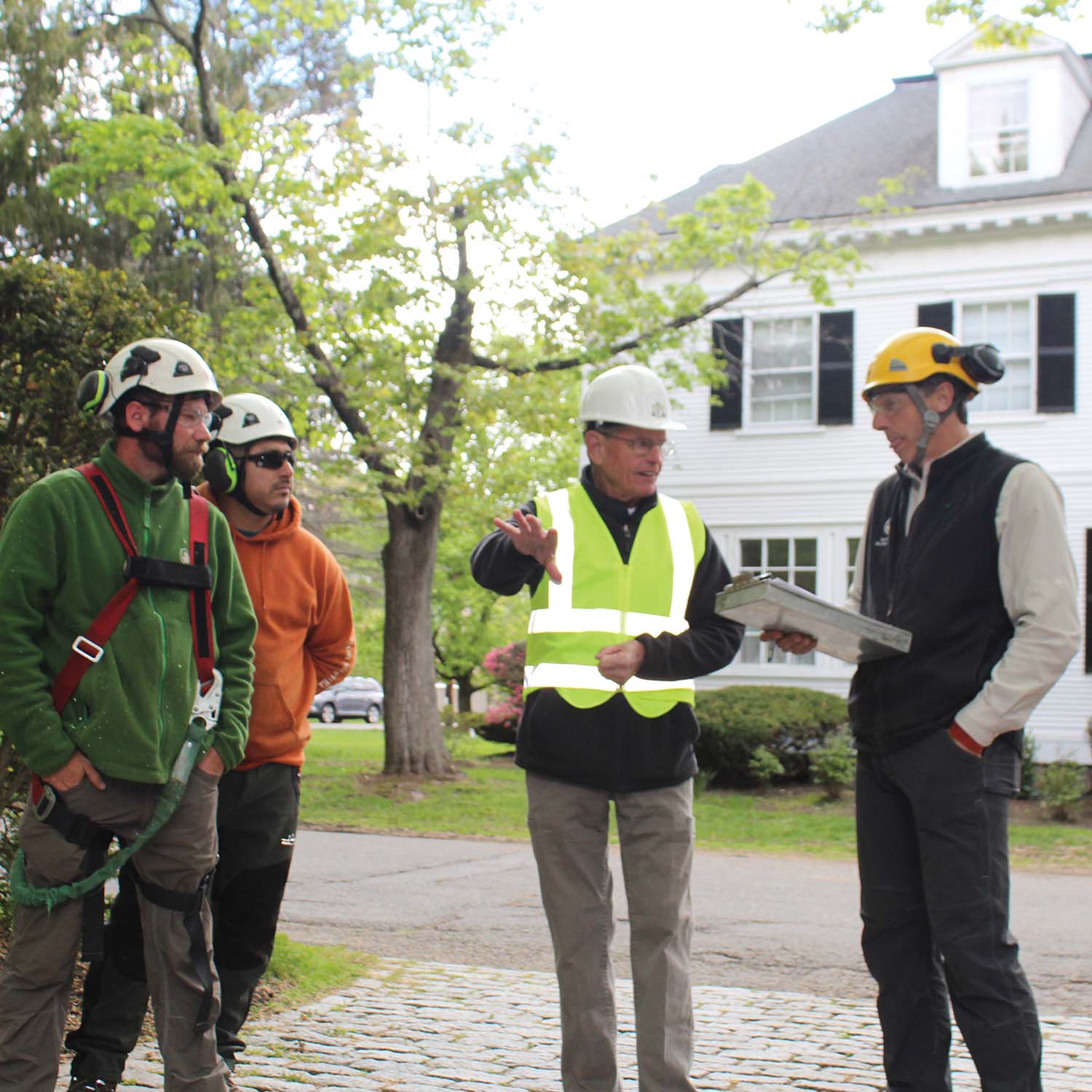 John Iurka, in hi-vis vest, on a re-accreditation audit job site in 2017 with staff of Harrison-McPhee Inc., an accredited, nine-year TCIA member company based in Millis, Massachusetts. All TCIA file photos, courtesy of Harrison-McPhee.