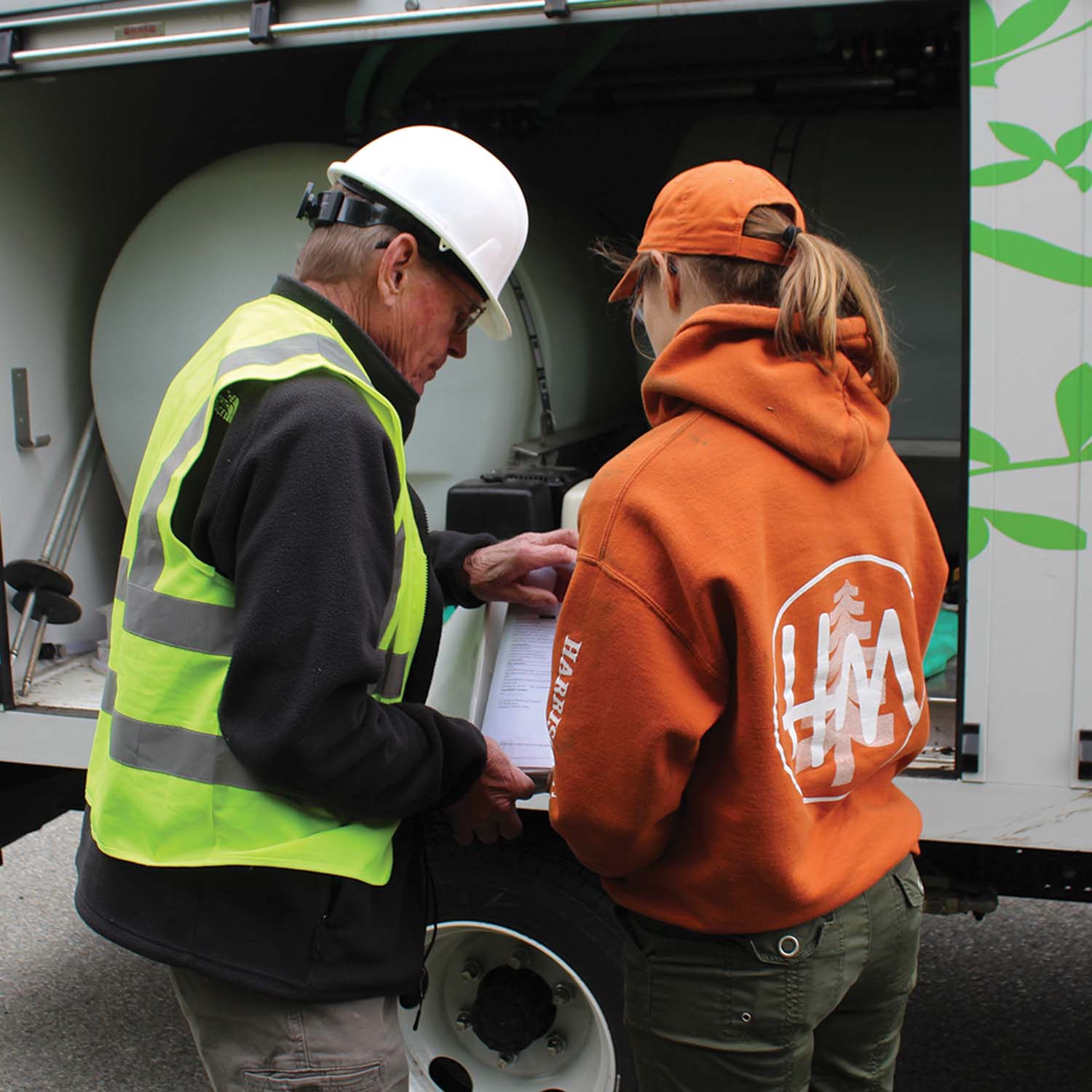 Iurka goes over PHC requirements with a Harrison-McPhee crew member.