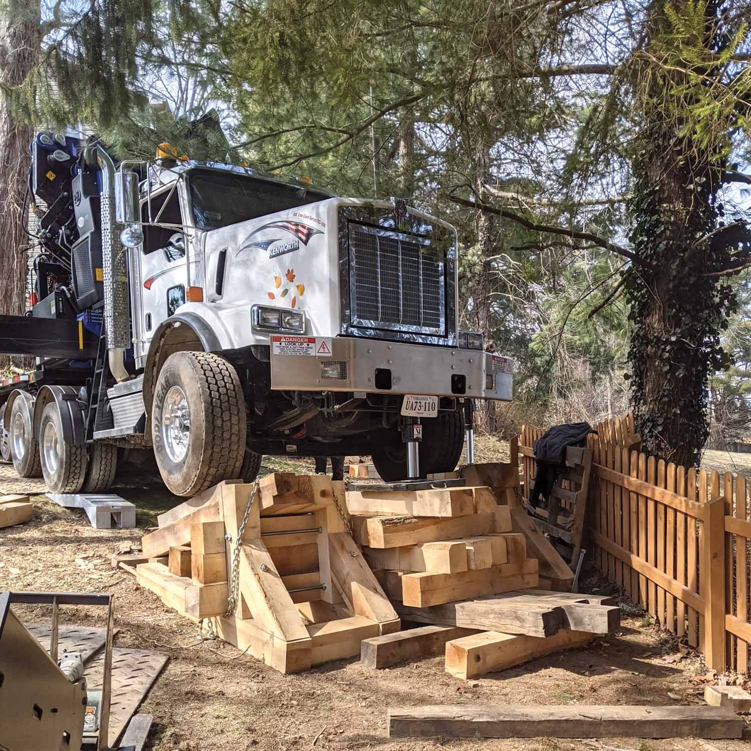 Cribbing is used, sometimes creatively, to level the crane on uneven ground.