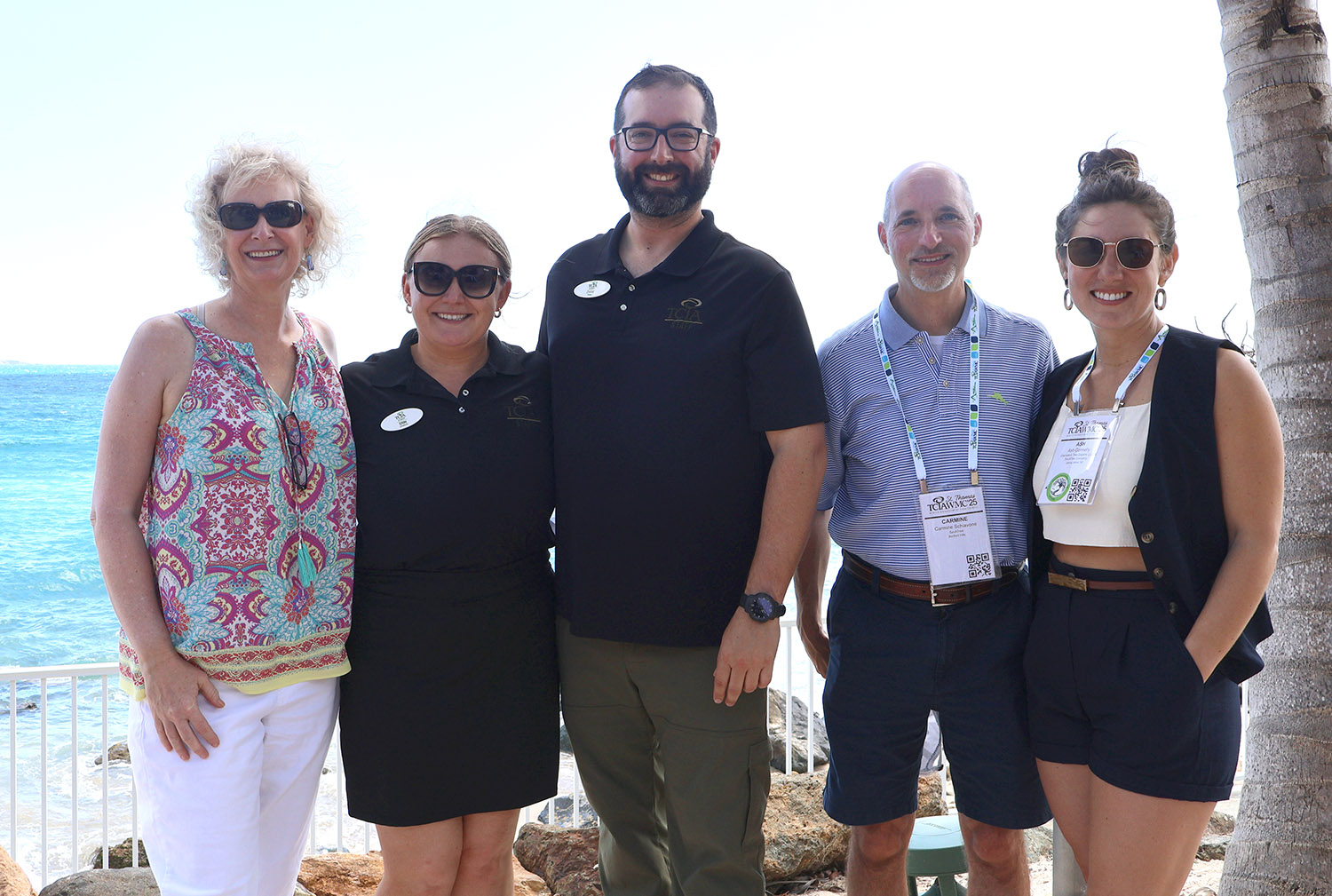 From left, Monica Hemingway, Tree Care Marketing Solutions; Erin Demers, TCIA; David White, TCIA; Carmin Schiavone, SavATree; and Ash Connelly, SavATree pose during TCIA’s Winter Management Conference ’25 in St. Thomas in February.